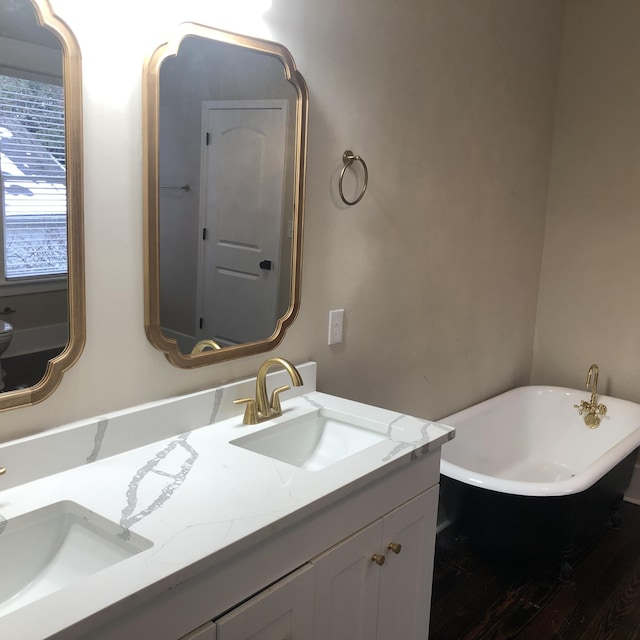 bathroom with vanity and a bathtub