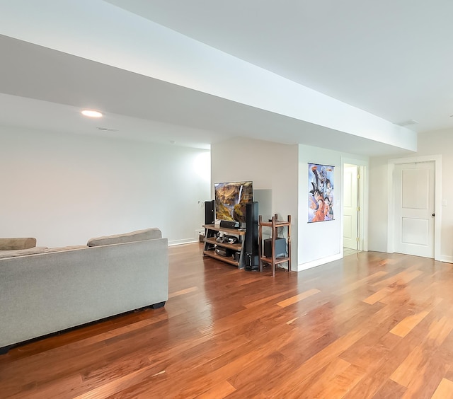 unfurnished living room with wood-type flooring