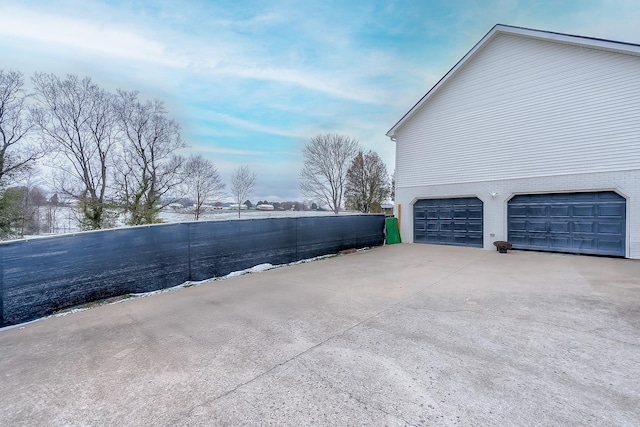 view of property exterior featuring a garage