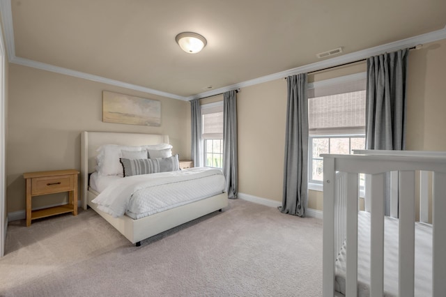 carpeted bedroom with multiple windows and ornamental molding