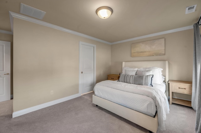 bedroom with ornamental molding and light carpet