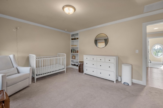 bedroom featuring crown molding, light carpet, and a nursery area