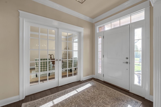 entrance foyer with dark hardwood / wood-style flooring, french doors, and ornamental molding