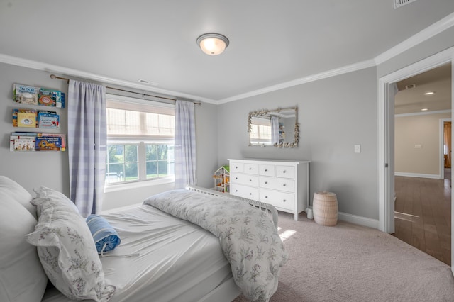 bedroom with carpet floors and ornamental molding