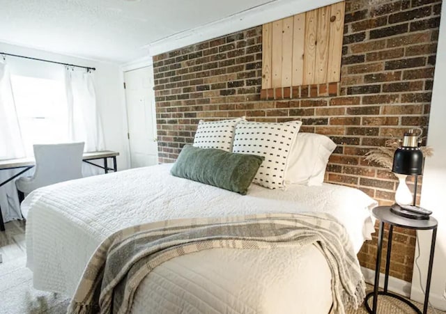 bedroom with brick wall