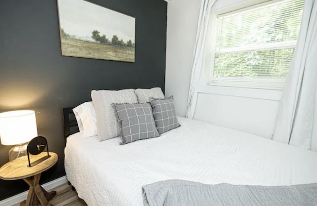 bedroom with wood-type flooring