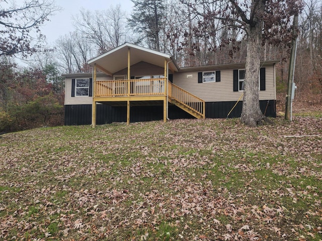 back of property with a wooden deck