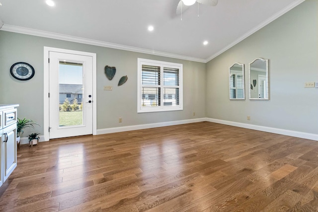 unfurnished living room with ceiling fan, wood-type flooring, and ornamental molding