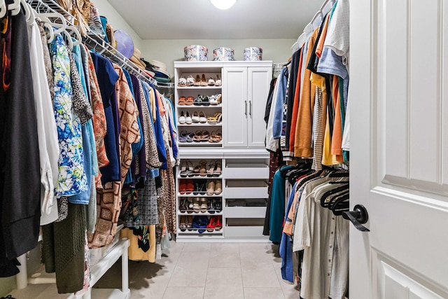 walk in closet featuring light tile patterned floors