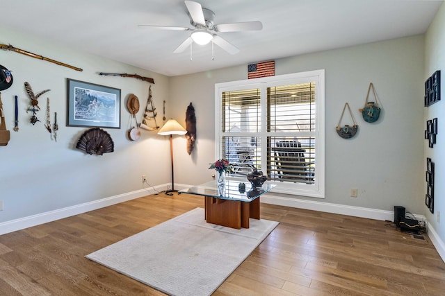 office space with dark hardwood / wood-style floors and ceiling fan