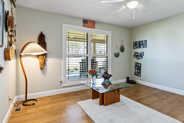 office space featuring ceiling fan and light hardwood / wood-style flooring