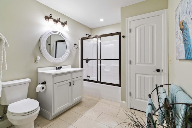 full bathroom featuring tile patterned flooring, vanity, toilet, and bath / shower combo with glass door