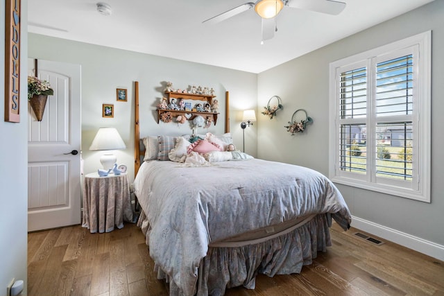 bedroom with ceiling fan and hardwood / wood-style flooring