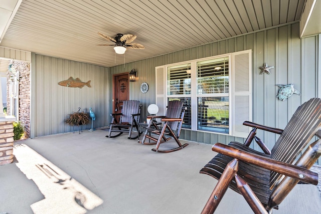 view of patio with ceiling fan and a porch