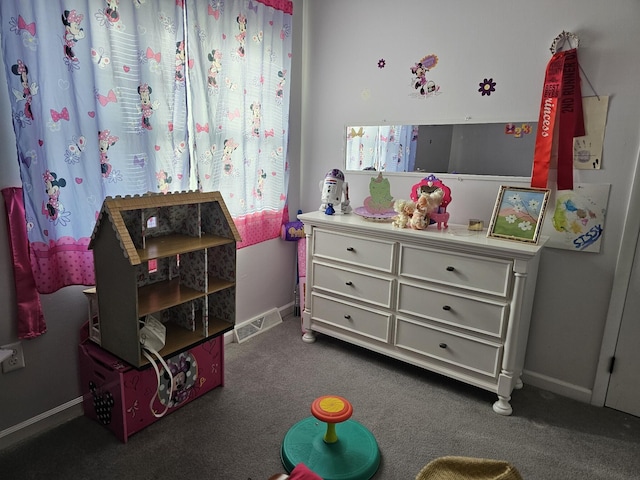 game room featuring dark colored carpet