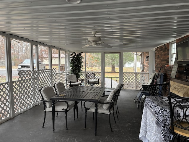 sunroom featuring ceiling fan