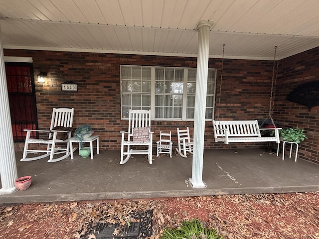 view of patio featuring a porch