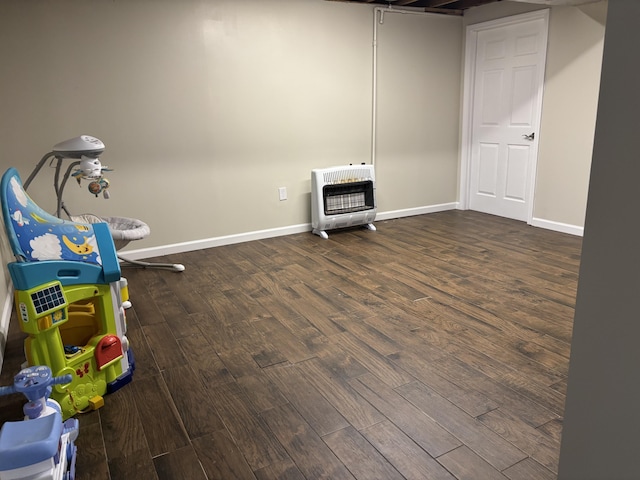 interior space featuring hardwood / wood-style floors and heating unit