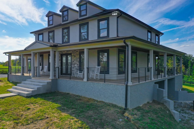 view of front of house featuring a porch and a front yard