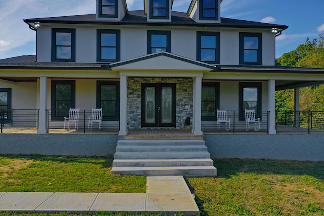 view of front facade featuring french doors and a porch