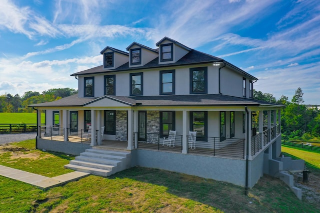 view of front facade with a porch and a front lawn