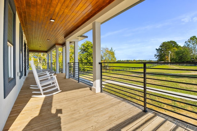 wooden terrace with a porch