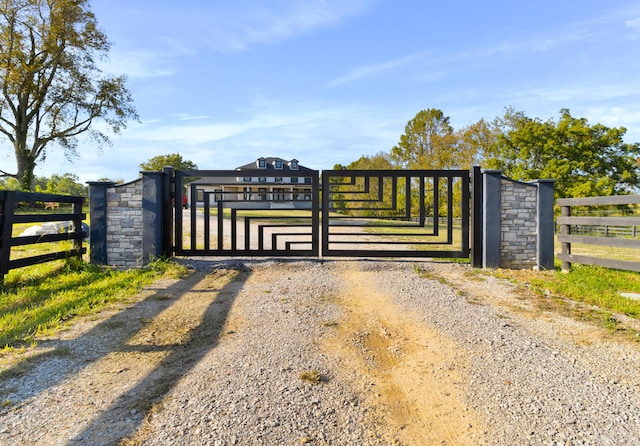 view of gate featuring a rural view