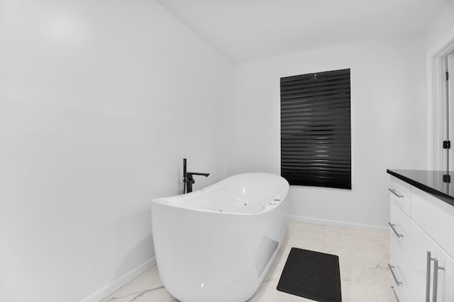 bathroom with vanity and a tub to relax in