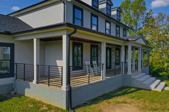 view of property exterior featuring covered porch