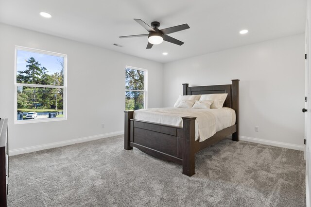 carpeted bedroom featuring ceiling fan