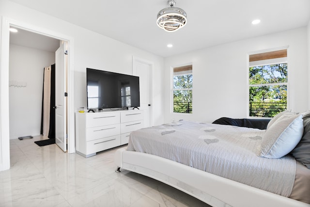 bedroom featuring multiple windows