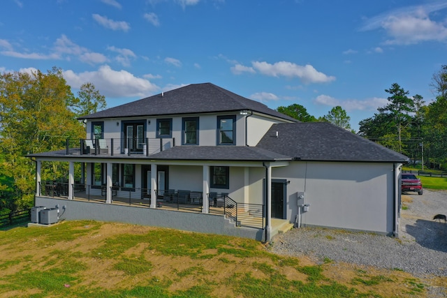 back of property with a porch and central air condition unit