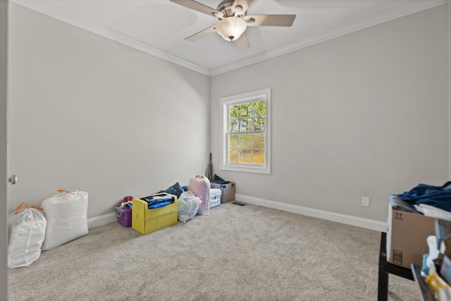 recreation room featuring light carpet, ceiling fan, and crown molding