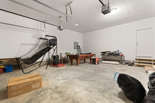 garage with electric panel and a garage door opener