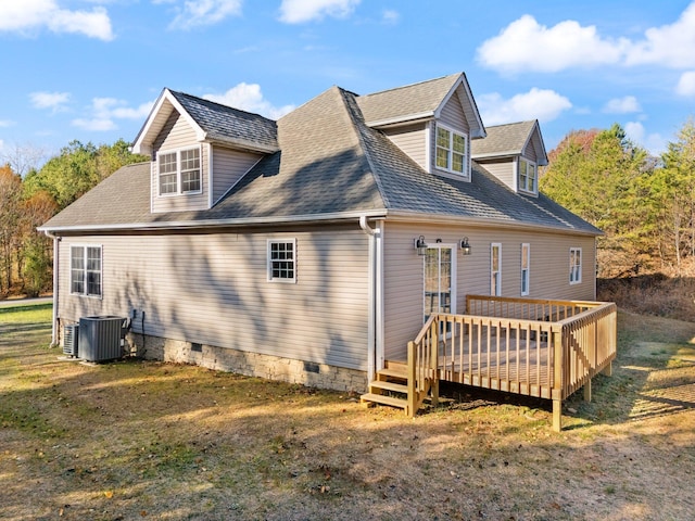 back of house with cooling unit, a yard, and a wooden deck