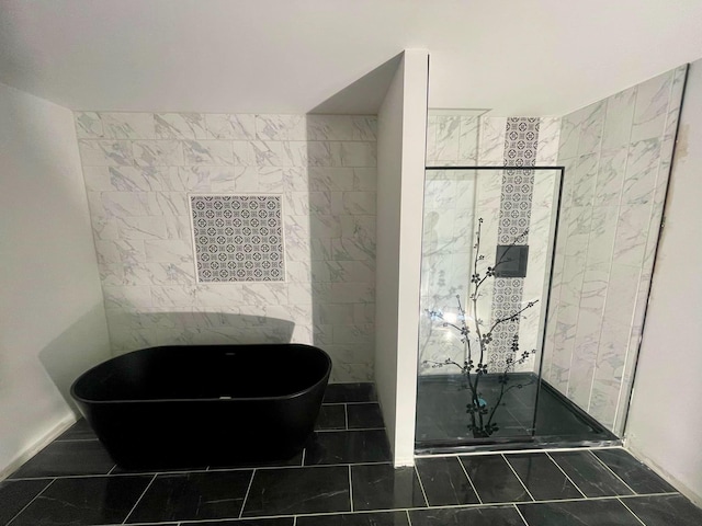 bathroom featuring tile patterned flooring and separate shower and tub