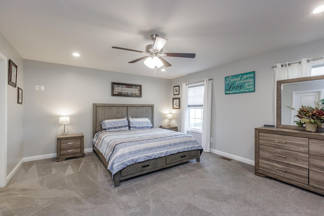 carpeted bedroom with ceiling fan