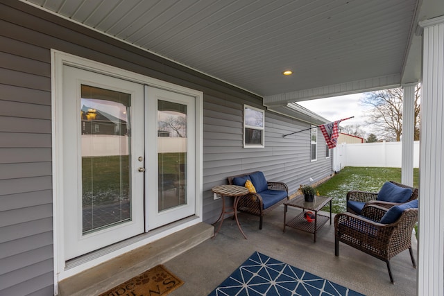 view of patio / terrace with french doors and a porch