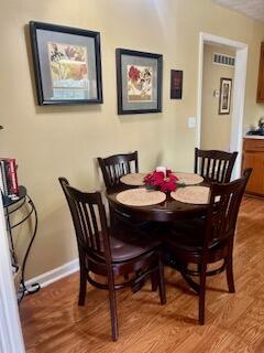 dining room with hardwood / wood-style floors