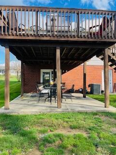 view of patio featuring central AC unit and a deck