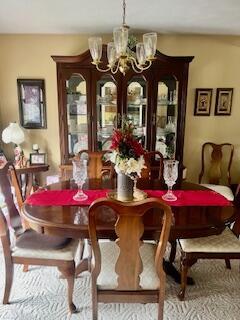 dining area featuring a chandelier