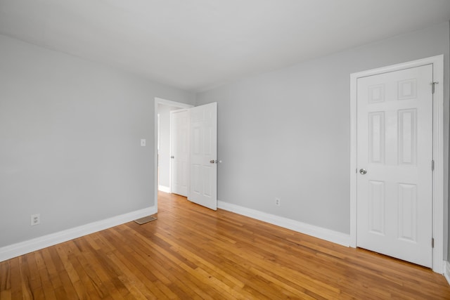 unfurnished room featuring light hardwood / wood-style flooring