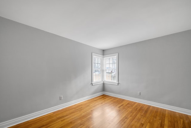 unfurnished room featuring hardwood / wood-style floors