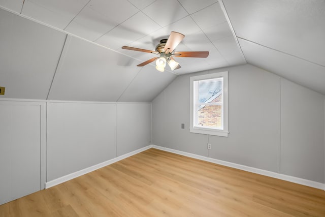 bonus room featuring ceiling fan, light wood-type flooring, and vaulted ceiling