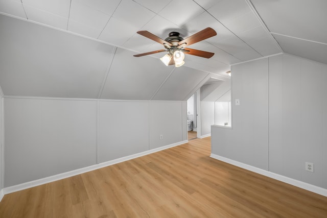 additional living space with ceiling fan, light wood-type flooring, and lofted ceiling