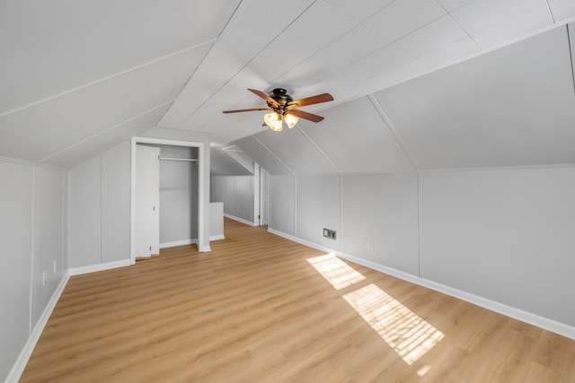 additional living space featuring ceiling fan, vaulted ceiling, and light hardwood / wood-style flooring