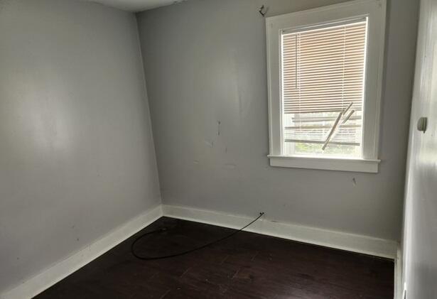 spare room featuring hardwood / wood-style floors