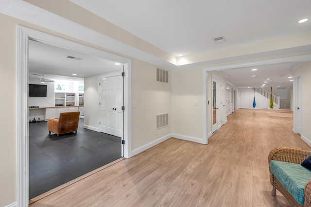 1821 Delong Rd, Lexington, KY 40515 - hallway with stairs, visible vents, and light wood-type flooring