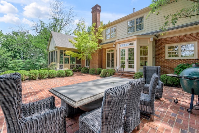 1821 Delong Rd, Lexington, KY 40515 - rear view of house featuring a chimney, a patio area, french doors, and brick siding