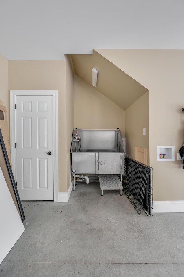 1821 Delong Rd, Lexington, KY 40515 - interior space with baseboards, lofted ceiling, and concrete floors